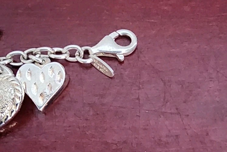 JCM 925 STERLING SILVER HEART CHARMS BRACELET. 8″. 20.80GRS. MADE IN MAURITIUS
