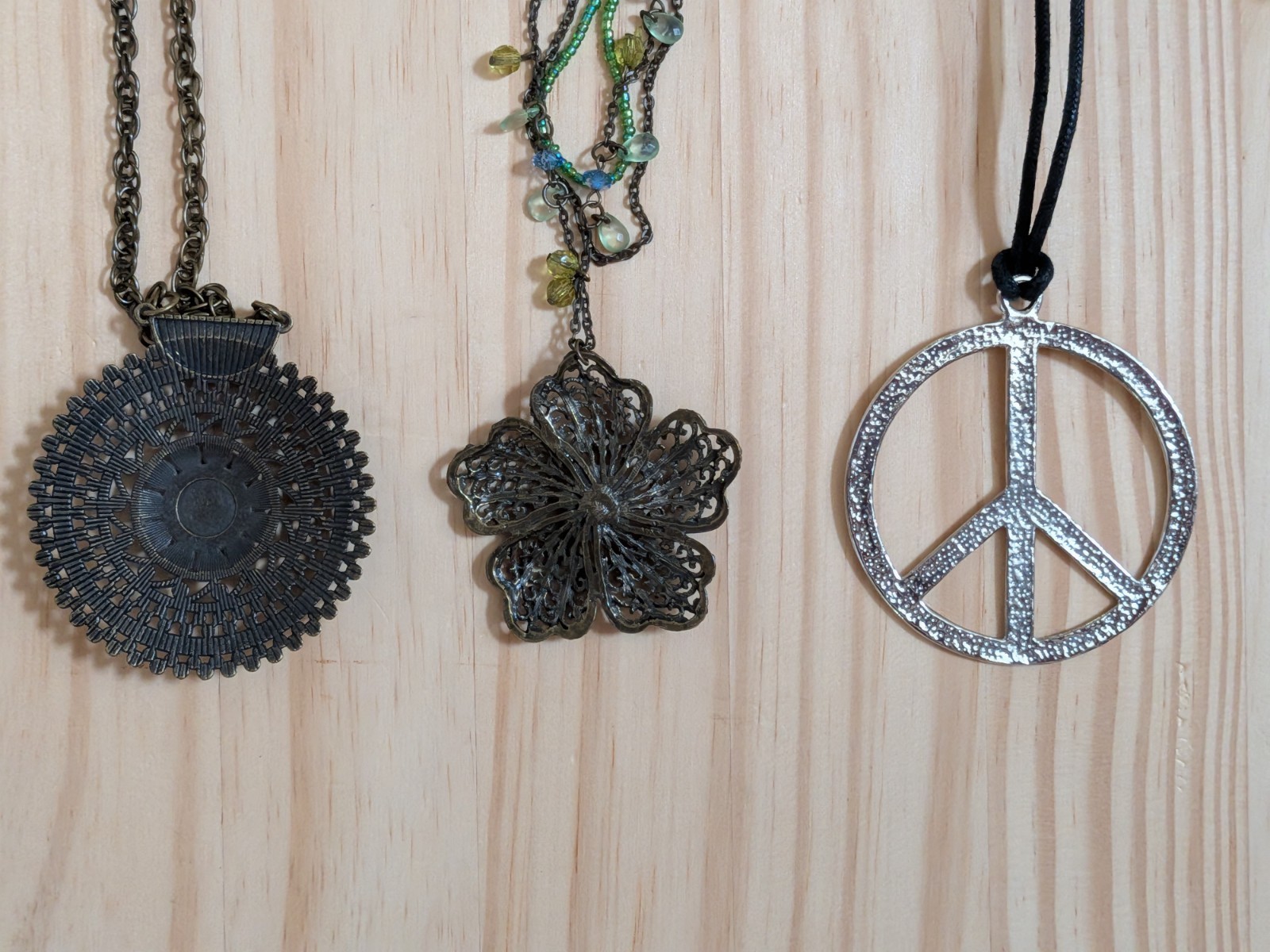 2 Boho Necklaces & 1 Retro: Medallion w/green hearts, Flower w/Beads, Peace Sign