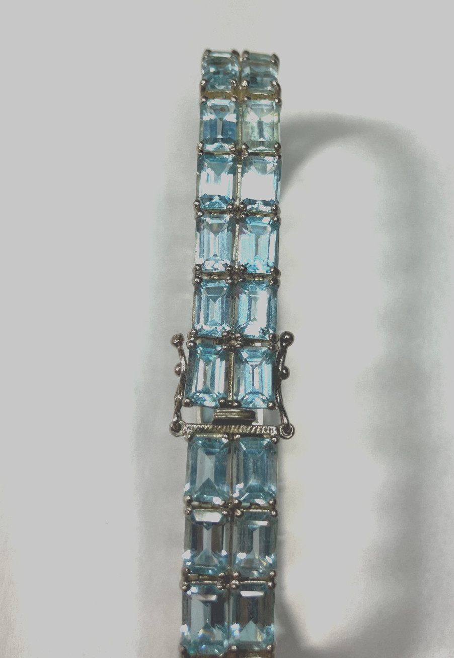 8” TENNIS BRACELET -ADI 925 STERLING SILVER – 40 EMERALD CUT TOPAZ STONES -NICE!