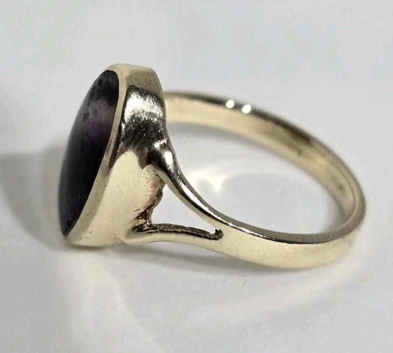 9ct Yellow gold open work ring. Collet set with an oval Blue John Cabochon.
