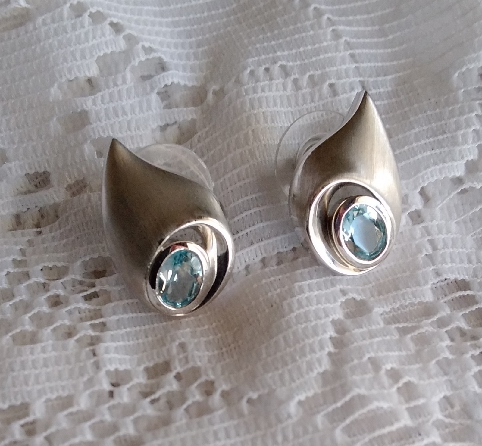 Unique Shape Blue Topaz Post Earrings Set In Satin Finish 925 Sterling Silver