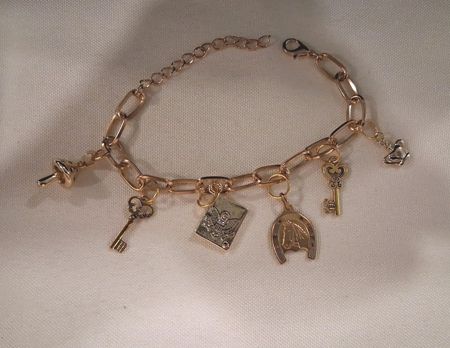 Goldtone Dangle Charm Bracelet, 6 Charms:Horse,Crown,Keys,Mushroom& Amer. Eagle