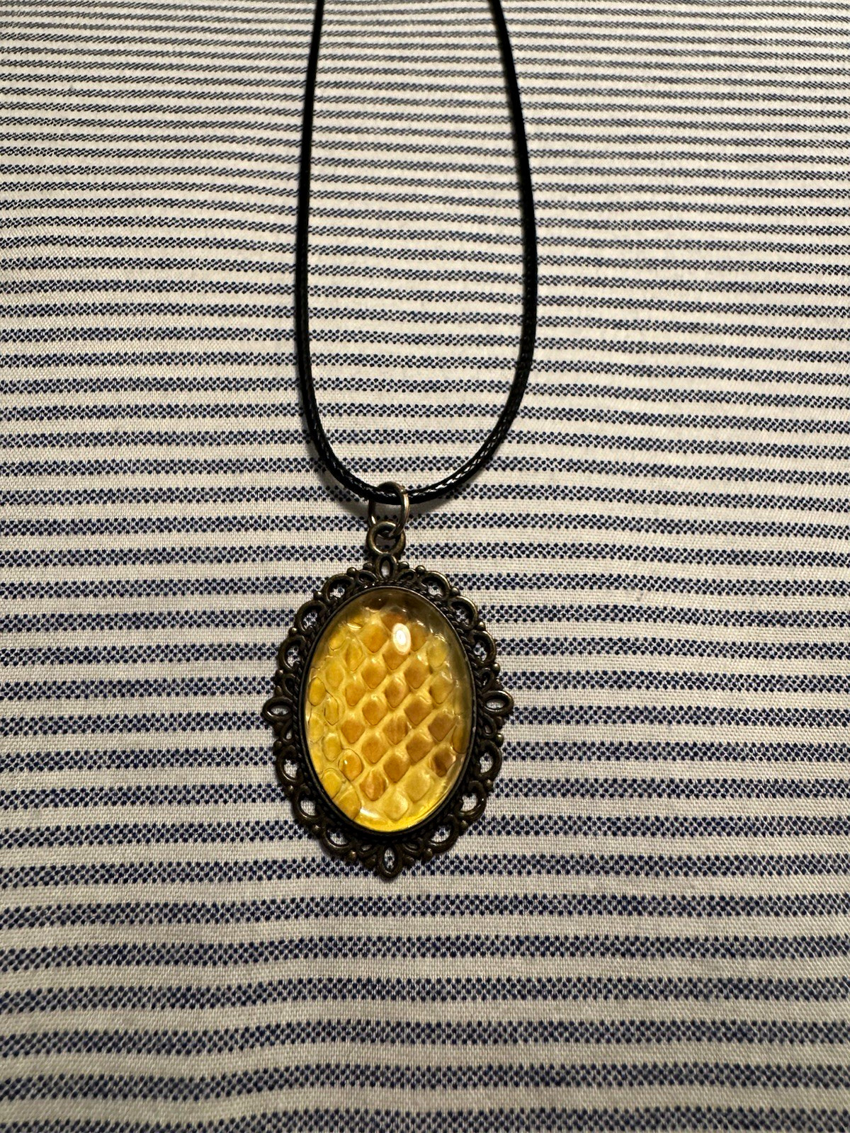 Black Cord Necklace with Oval Yellow Locket Pendant, Bezel Set Metal