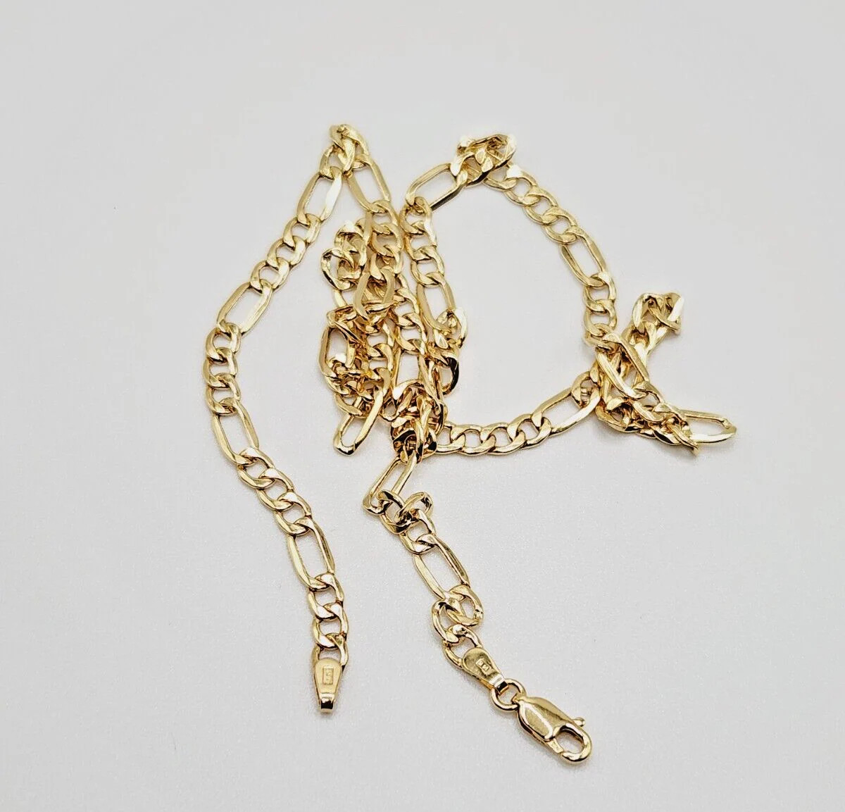 14Kt Yellow Gold Figaro Chain Hollow 18.0 Inches long x 4.40 mm x 1.39mm