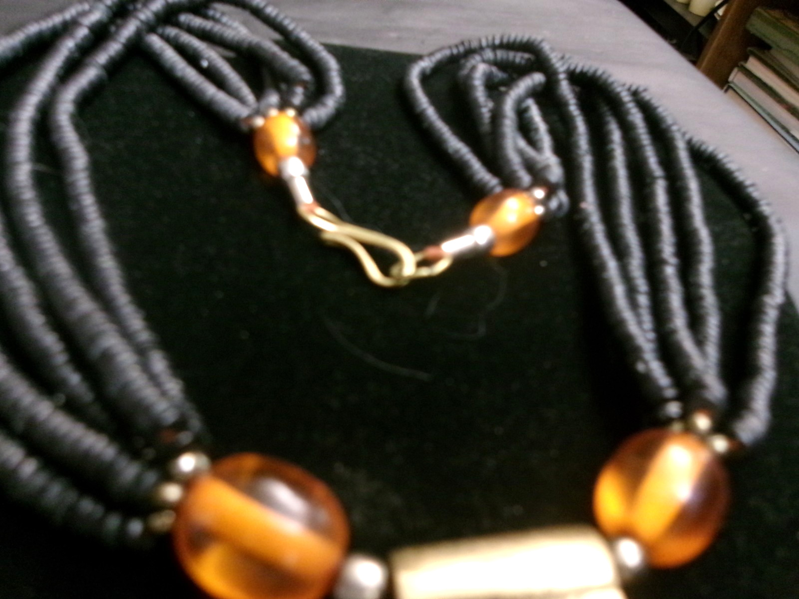 African ethnic tribal necklace features a round pendant brass