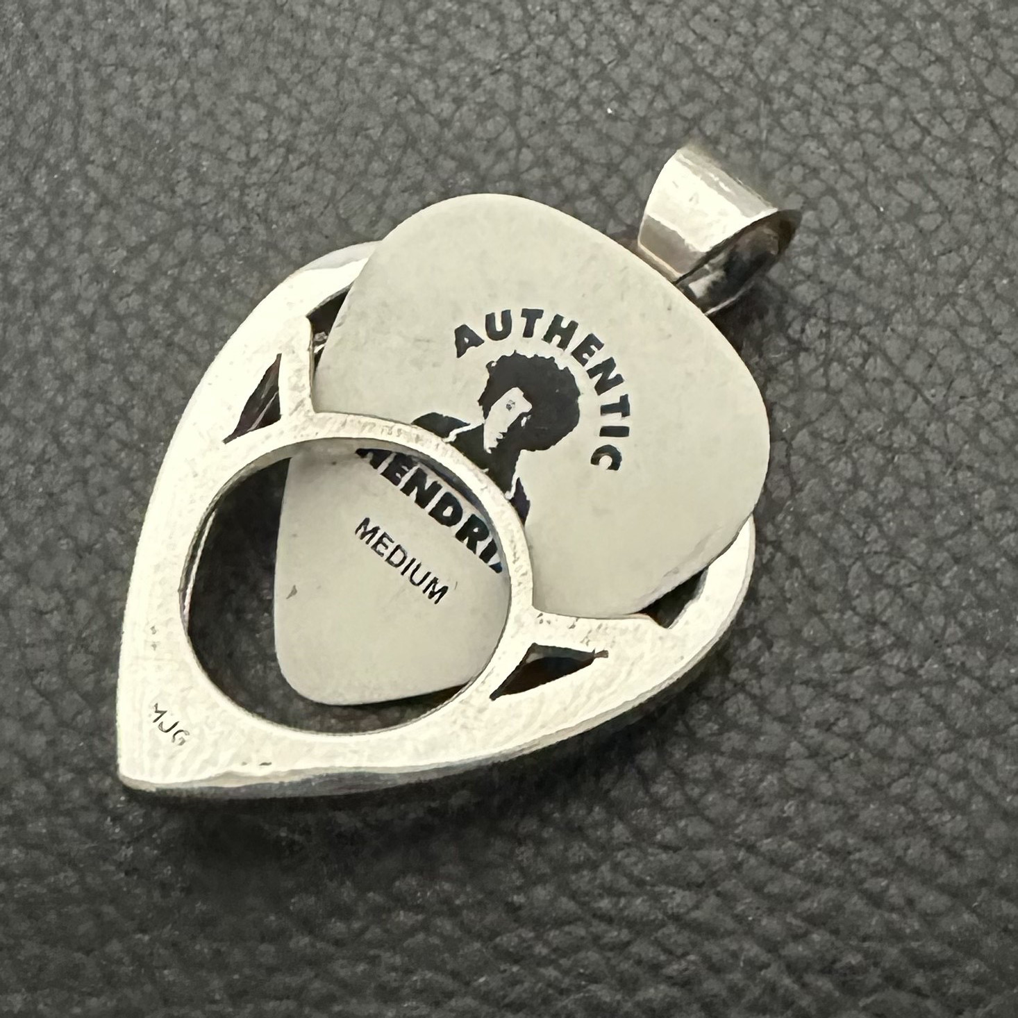 MJG STERLING SILVER. GUITAR PICK HOLDER/ PENDANT + CHAIN. JIMI. 12 GRAMS.