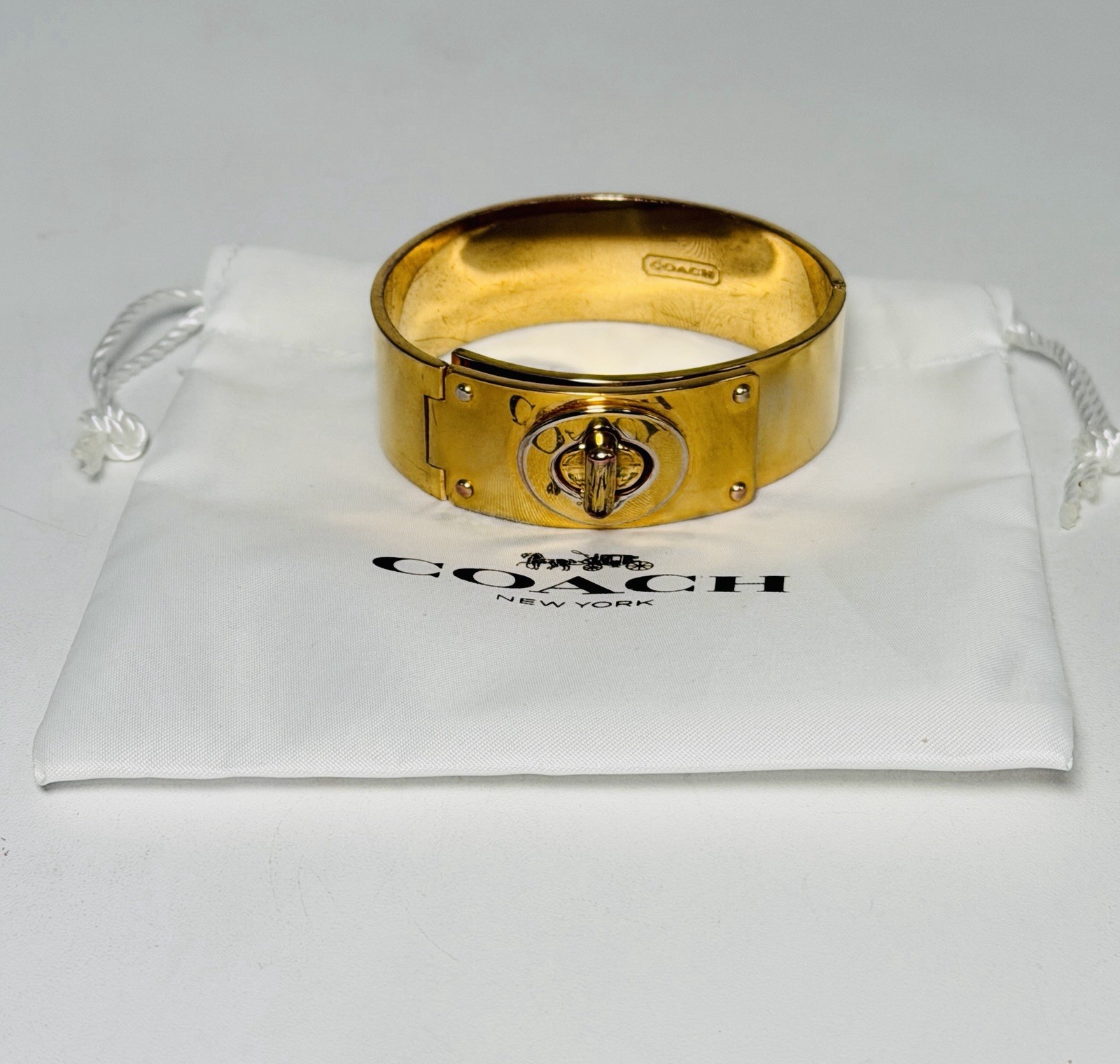 Coach Shiny Gold Turn Lock Bracelet Bangle Opens closes 3/4″ Thick