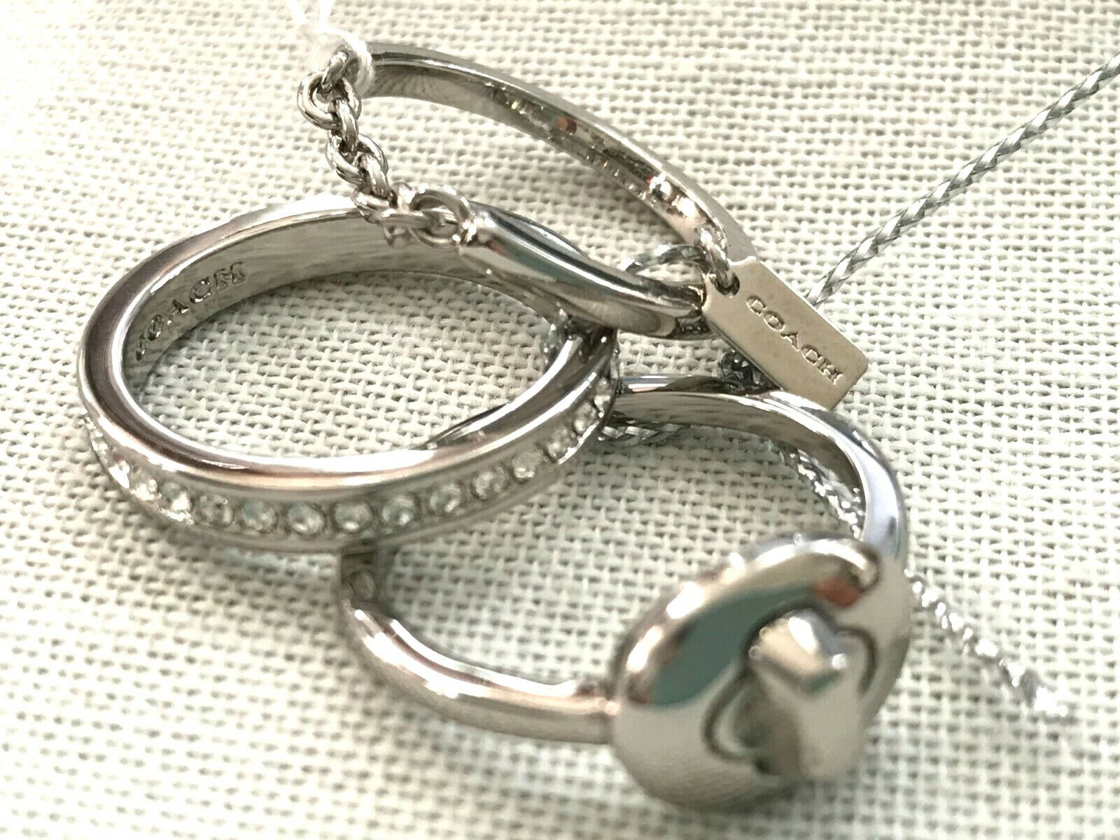 Coach pave turn-lock ring set