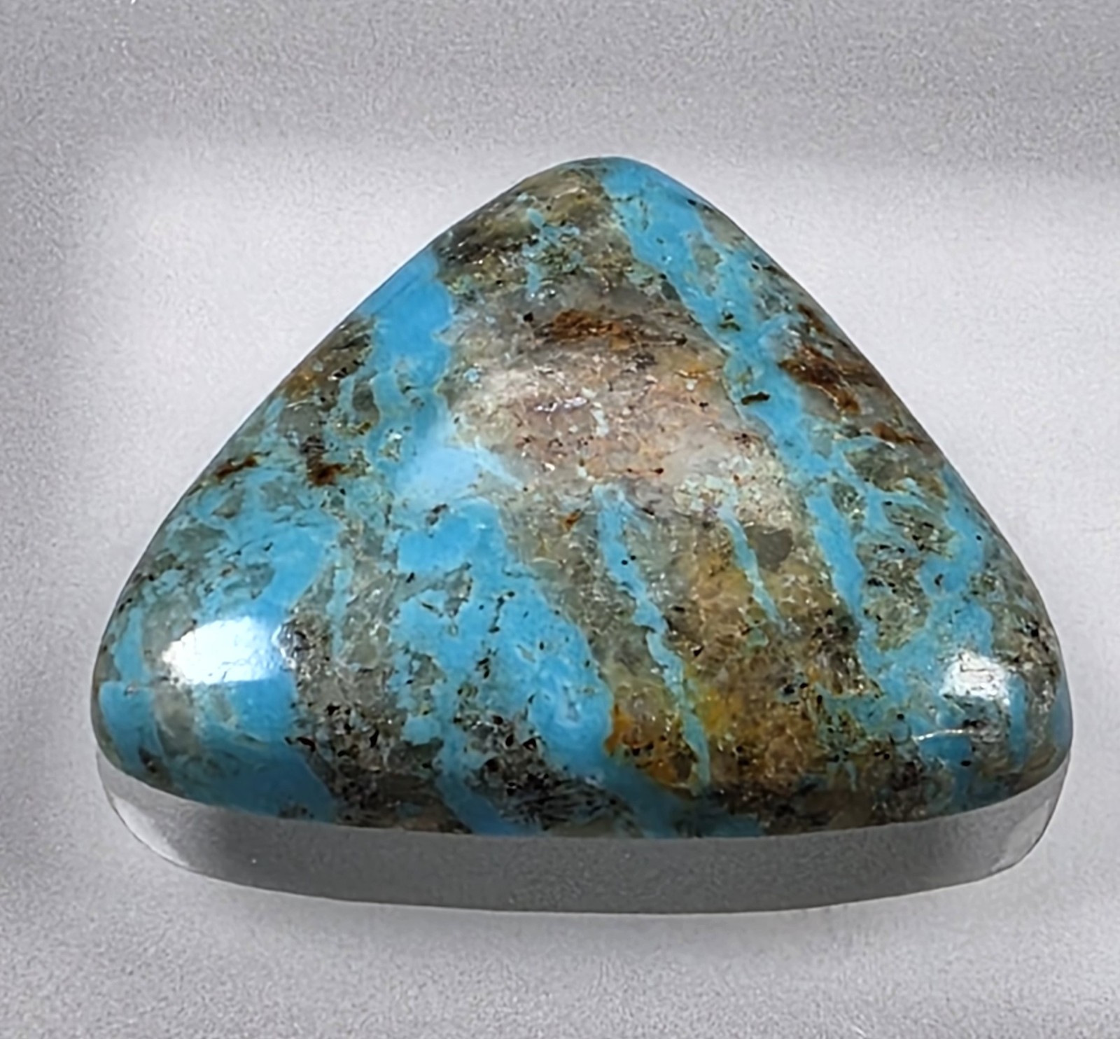 Kingman turquoise cabochon, boulder pattern, trillion cut, 30.49 carats, #B23