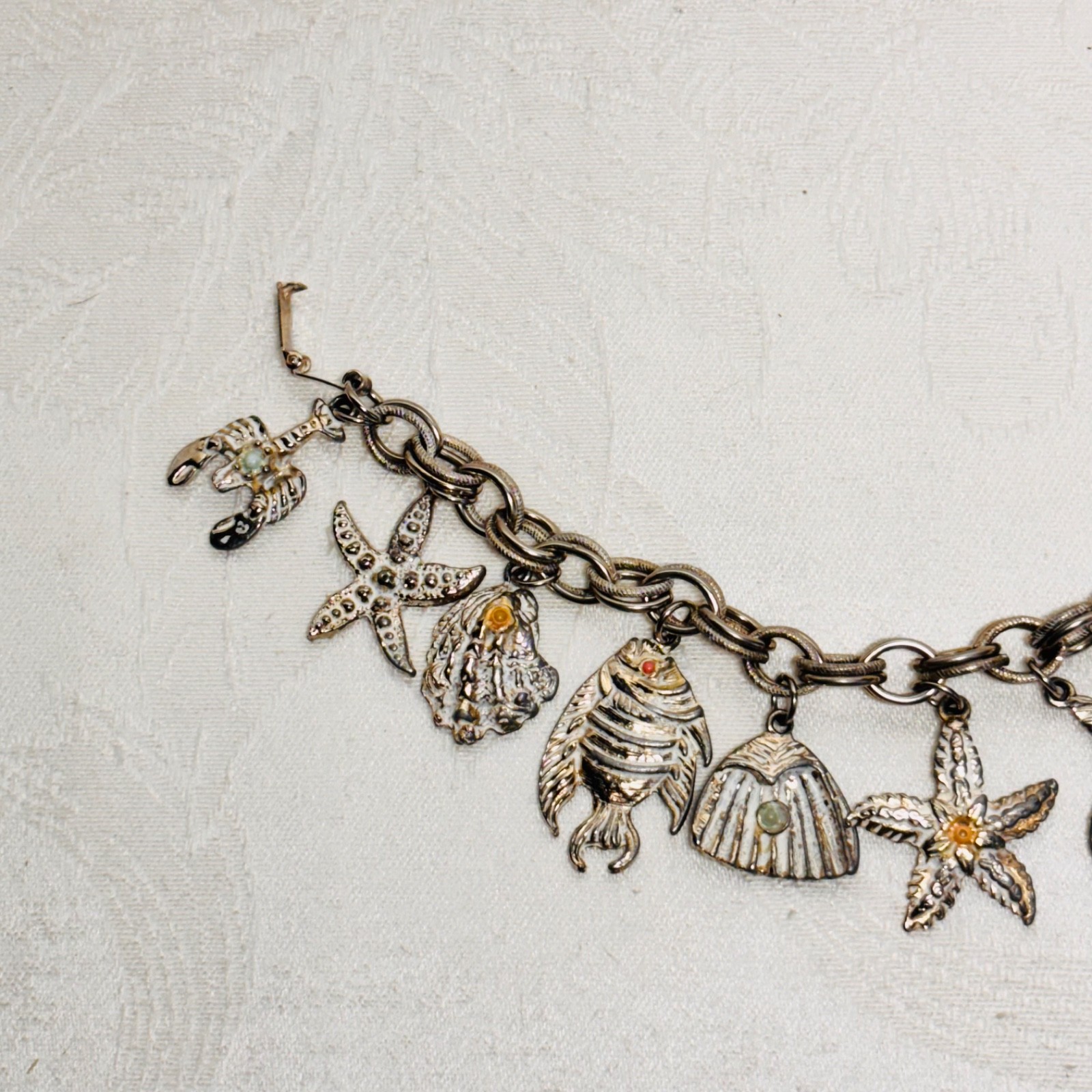 BRACELET ocean life charms starfish shells fish lobster fold over clasp vintage