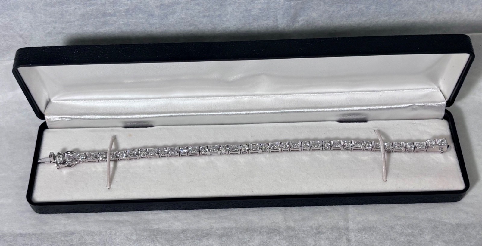 New In Case~Rhodium Plated CZ Tennis Bracelet Safety Lock 7.25” Princess/Round
