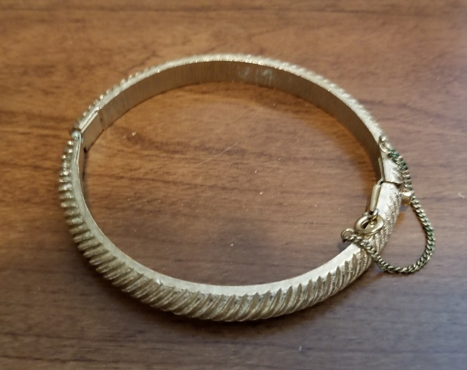 Vintage Crown Trifari Gold Hinged Bangle Bracelet With Safety Chain.