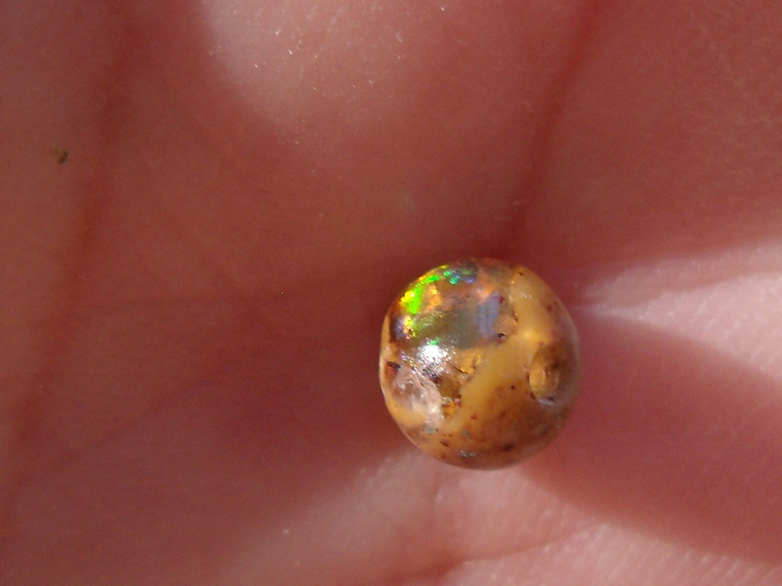 0.82 Ct. Round Cut Mexican Cantera fire opal bead.