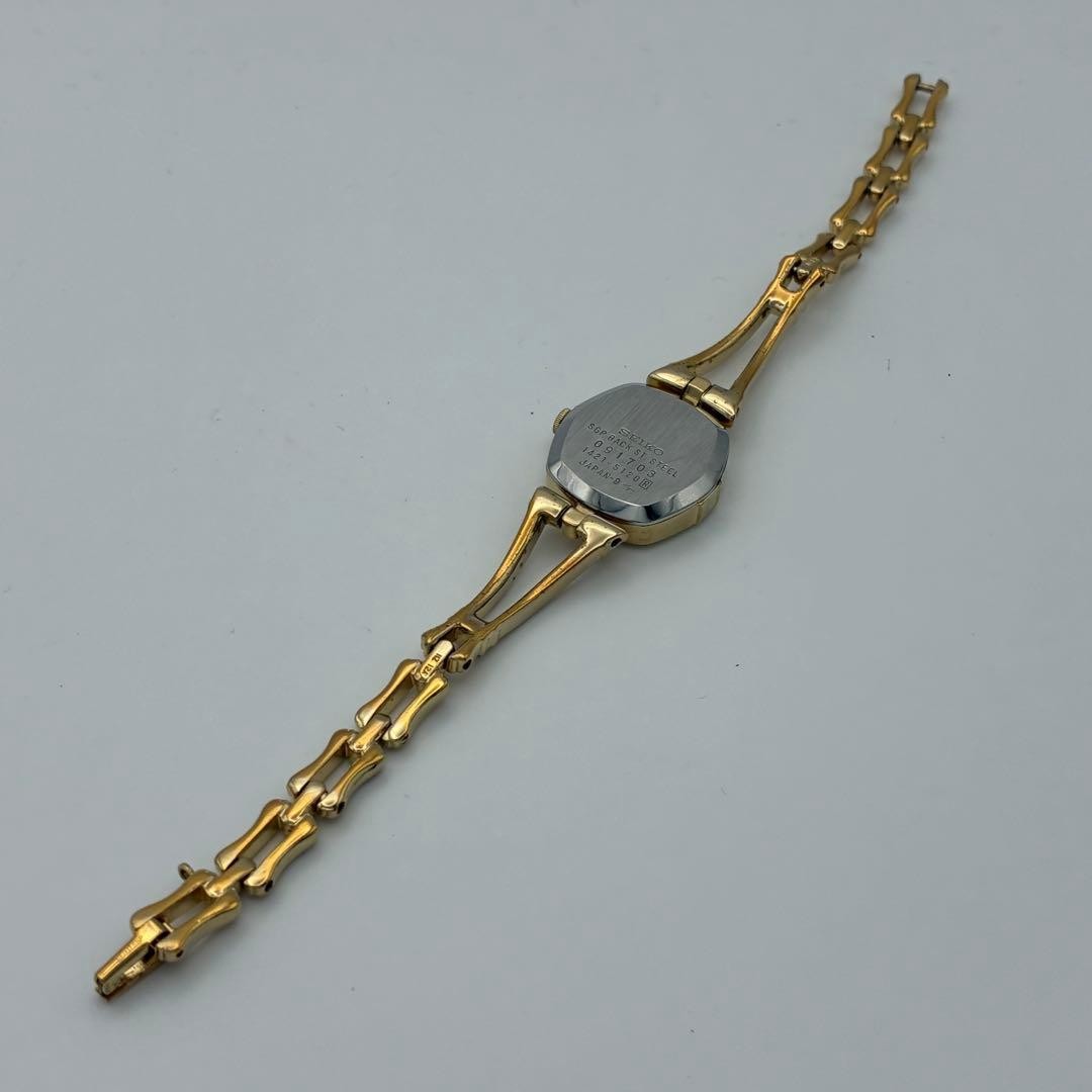 Working SEIKO wristwatch, gold and black, with new battery (A72)