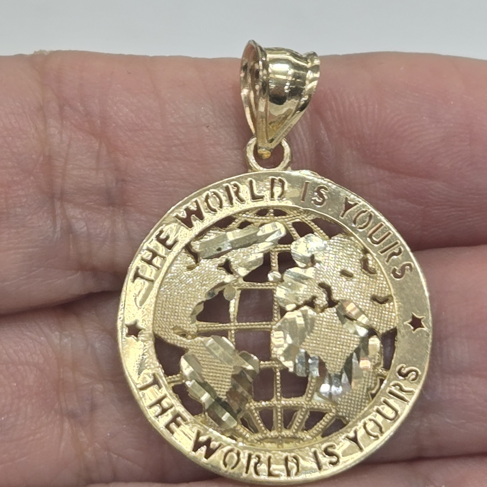 10k Yellow Gold The World Is Yours pendant
