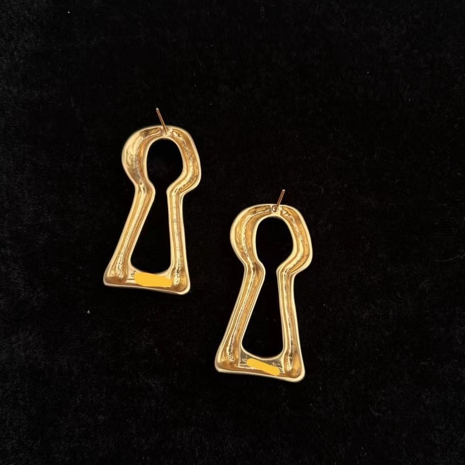 Schiaparelli Simple elegant keyhole style earrings with box