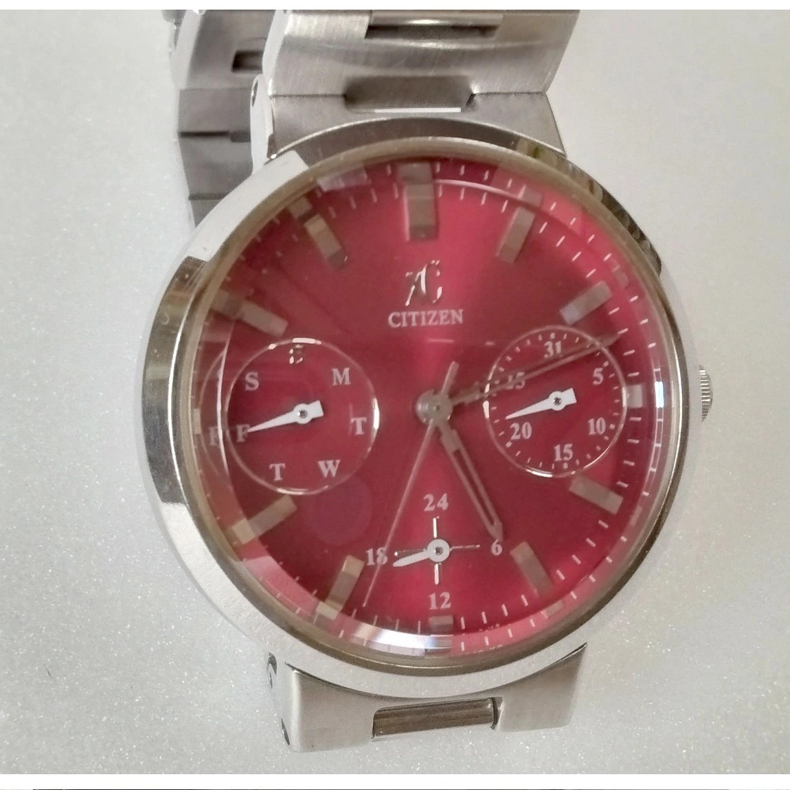 Used fully functional Citizen women’s red dial chronograph watch XC day date wit