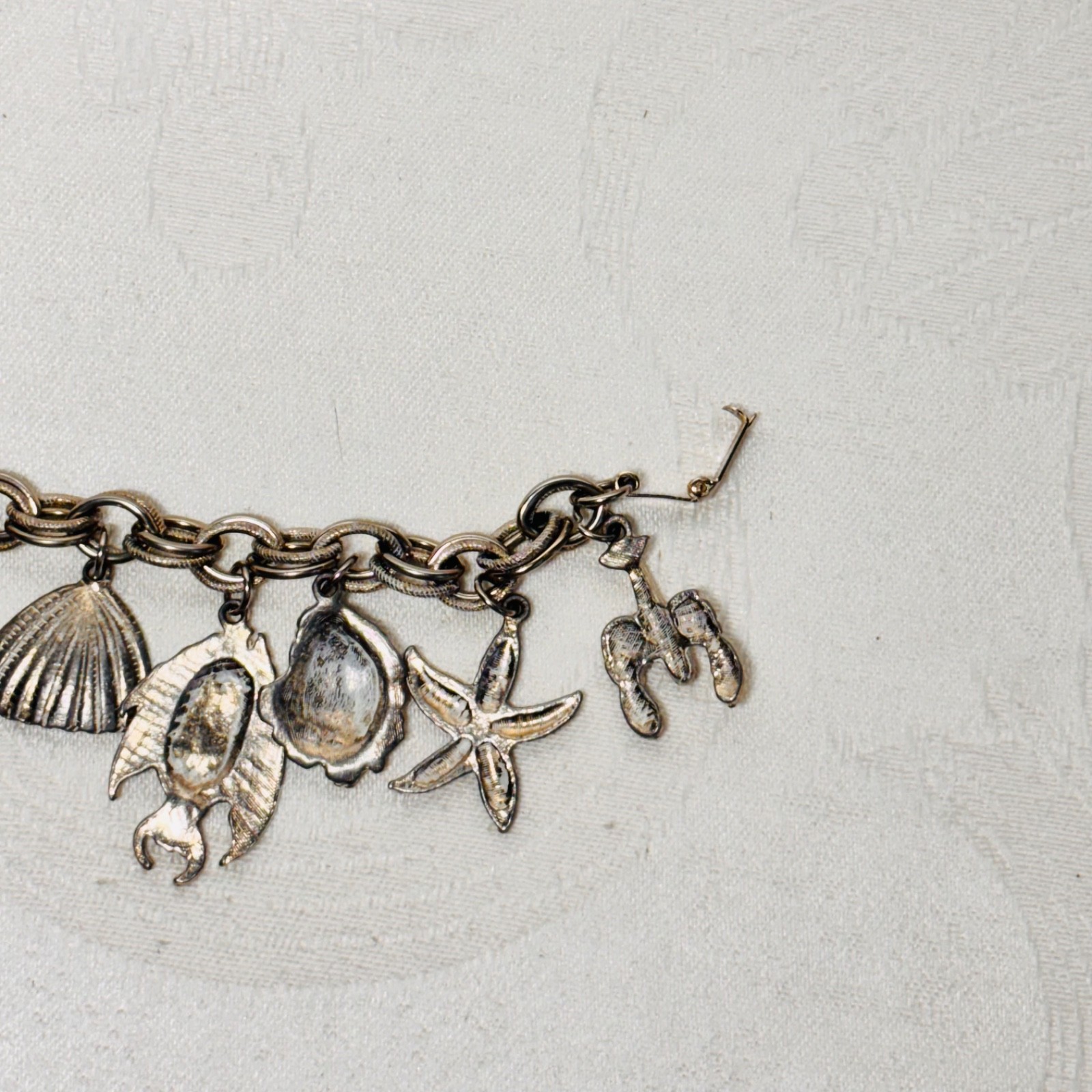 BRACELET ocean life charms starfish shells fish lobster fold over clasp vintage