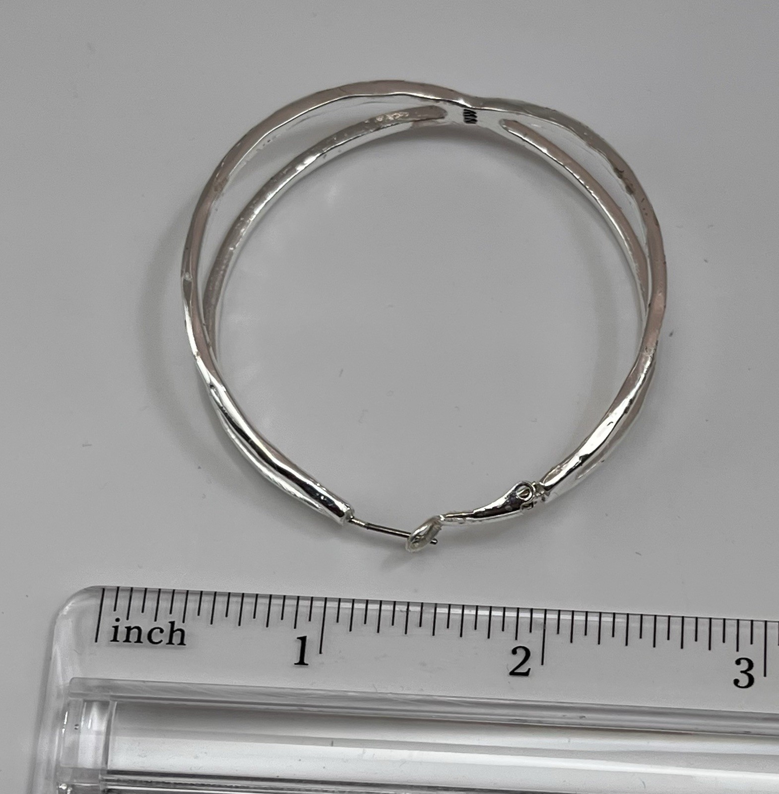 large silver-tone twisted hoop earrings