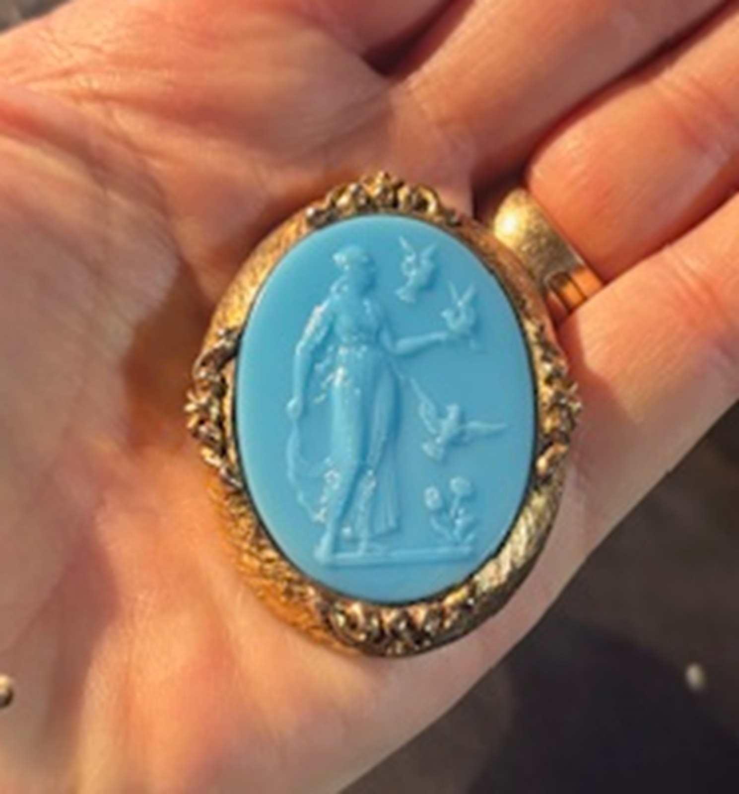 Antique Blue Cameo Brooch with classical figure in an ornate gold-tone frame