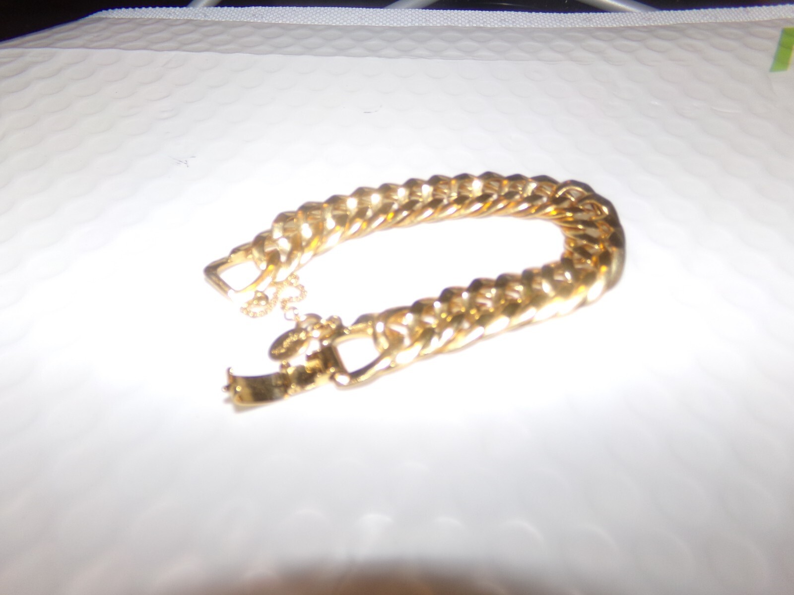 SIGNED ROGET TM GOLDTONE BRACELET WITH SAFETY CHAIN