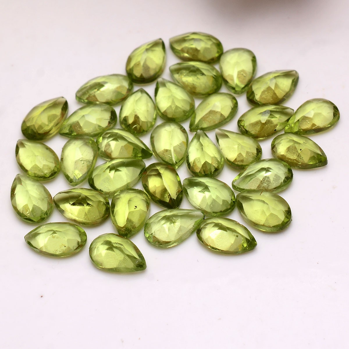 32 Pcs VVS Natural Peridot 7.74mm-8.20mm Pear Cut Stunning Untreated Gemstones