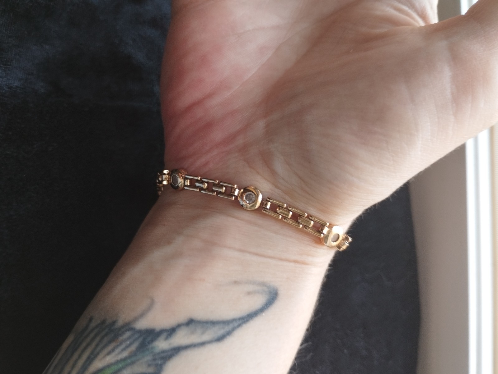 Gold-colored bracelet.