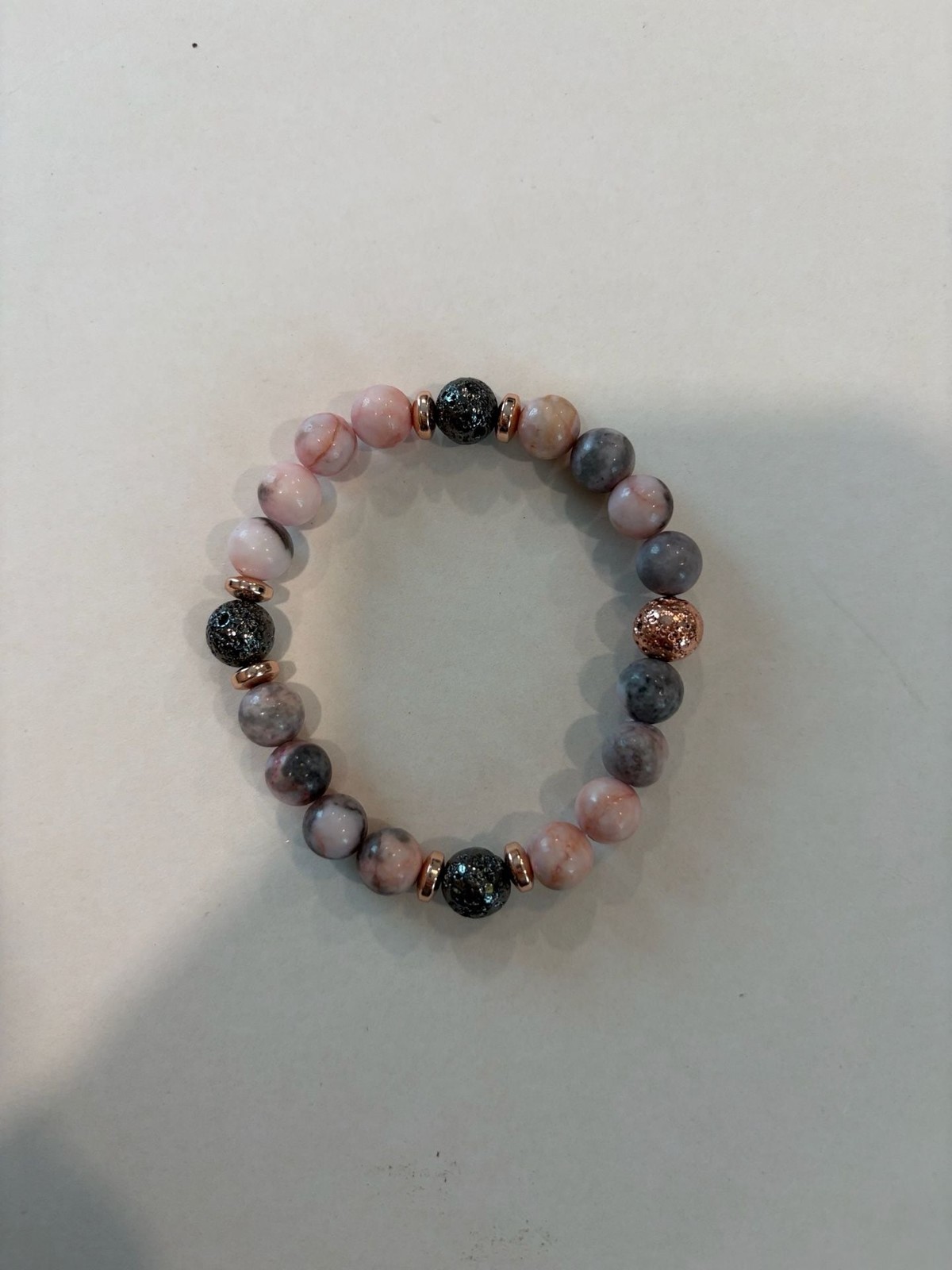 Set of 5 Rose Gold Tone Fashion Bracelets, a Ring and a Charm