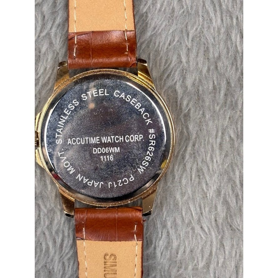 Accutime Watch Corp Stainless Steel Caseback Gold Tone Black Face