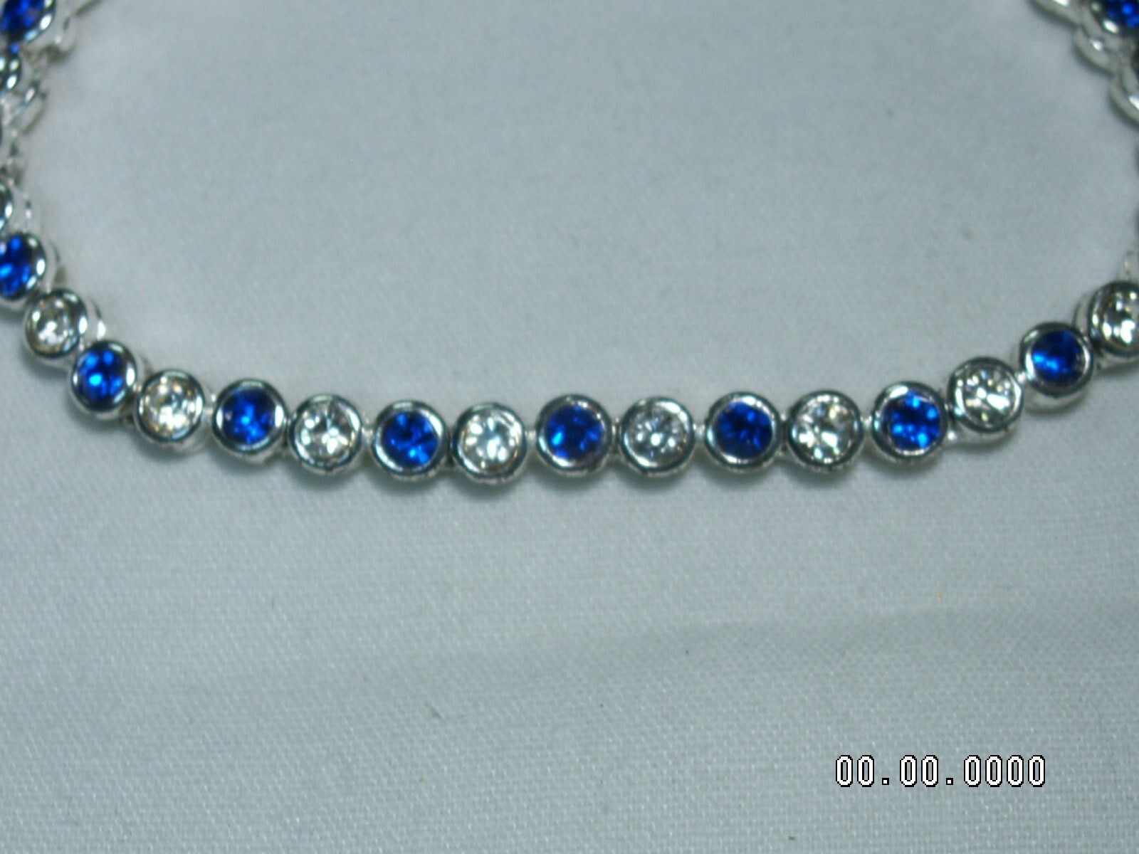 2002 AVON…Silver Tone,Sapphire Blue Crystals Bracelet & Pierced Earrings Set