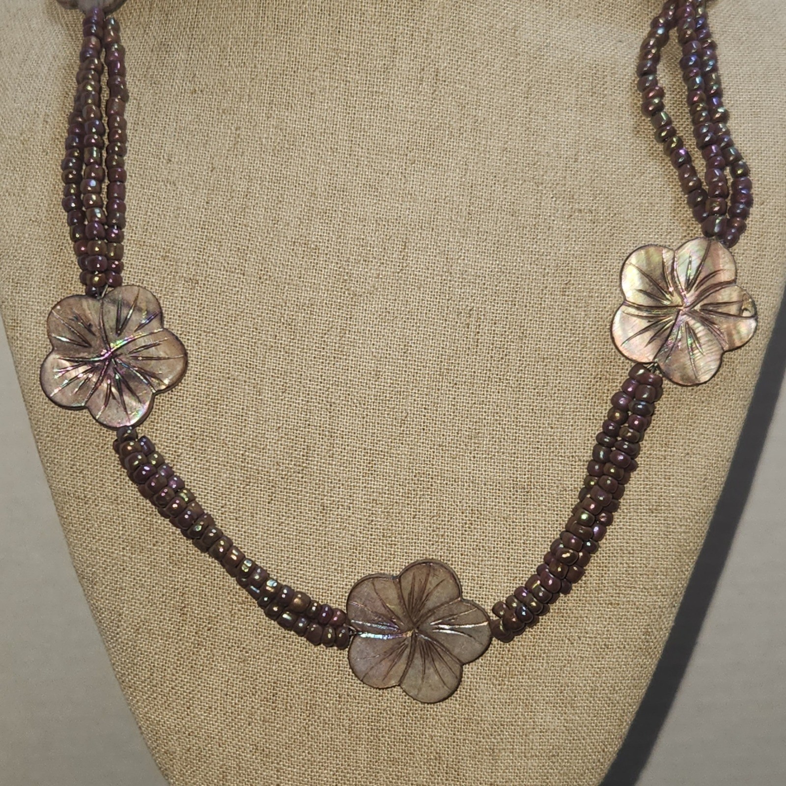 Iridescent Mauve Multi Strand Seed Bead Necklace Carved Shell Flower Toggle 21in