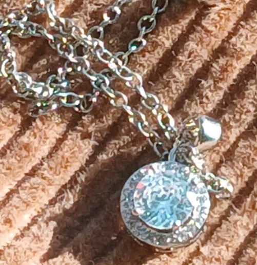 White glimmering Stone in Silvertone. Chain. Dainty Nice