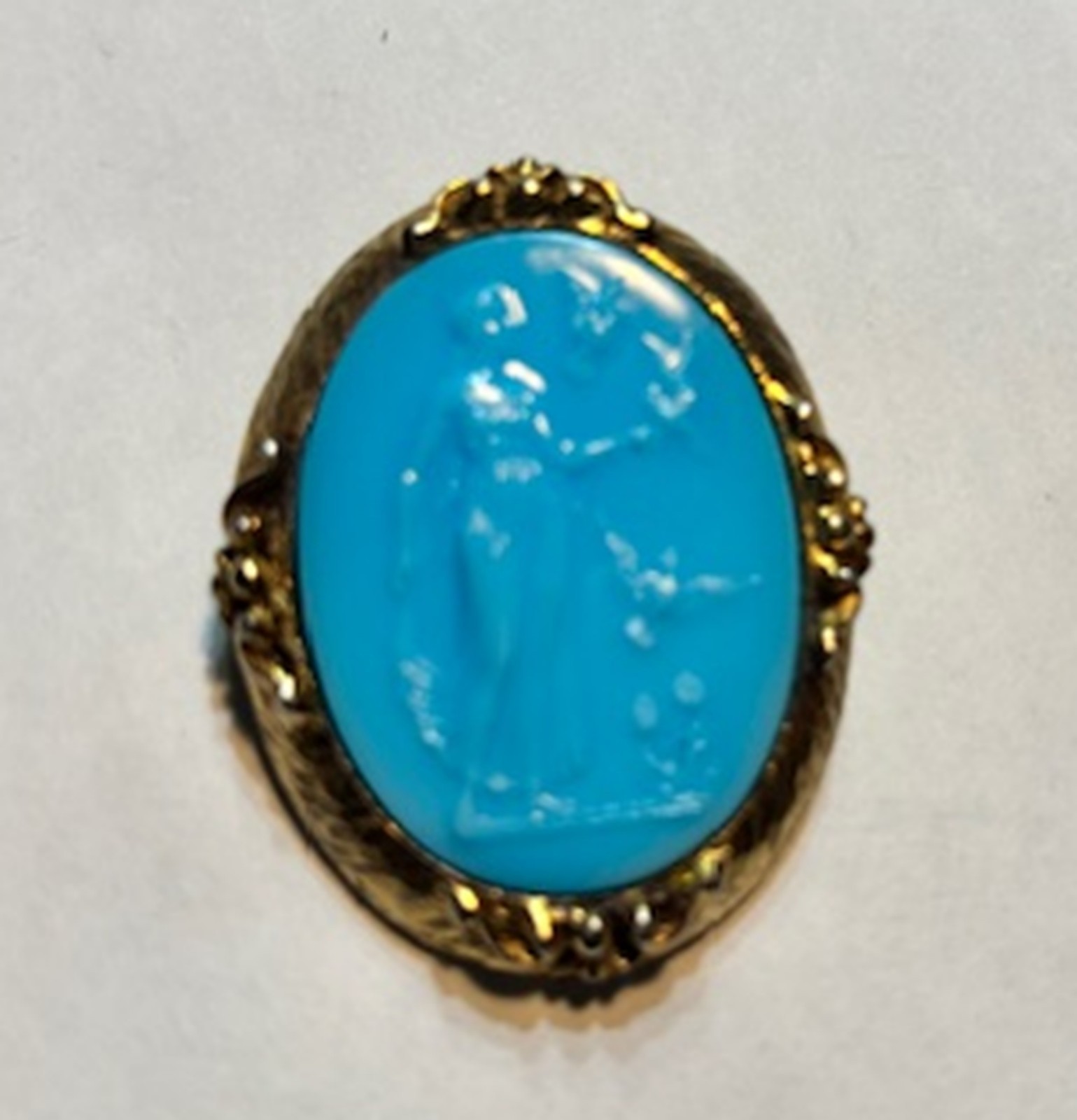 Antique Blue Cameo Brooch with classical figure in an ornate gold-tone frame