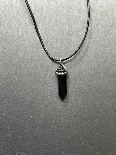 Black Tourmaline Pendant hanging from a 16″ Leather Cord with a 2′ extender