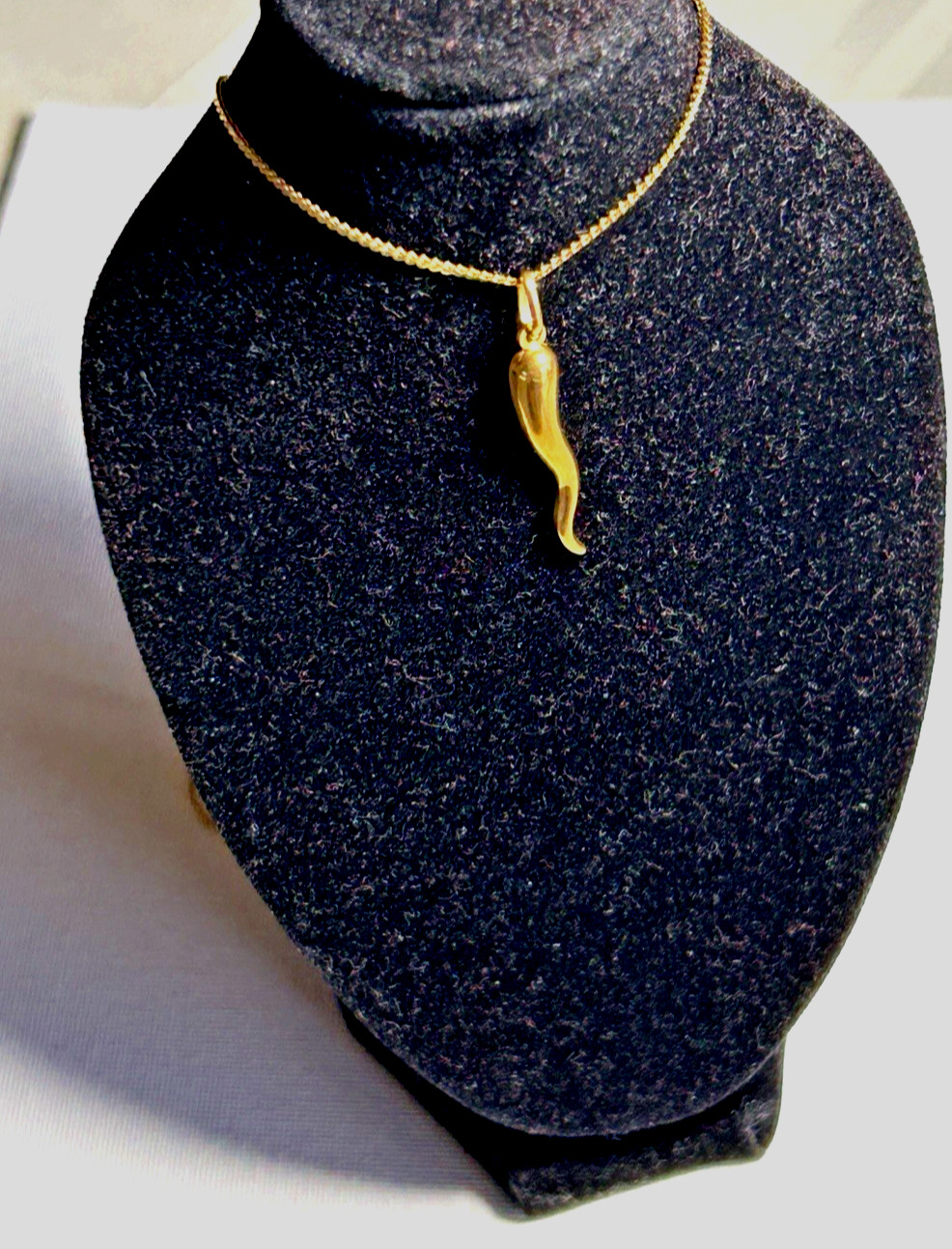 18k solid gold Italian horn weight is 1.2gr. includes 28″ 18K gold Neckless