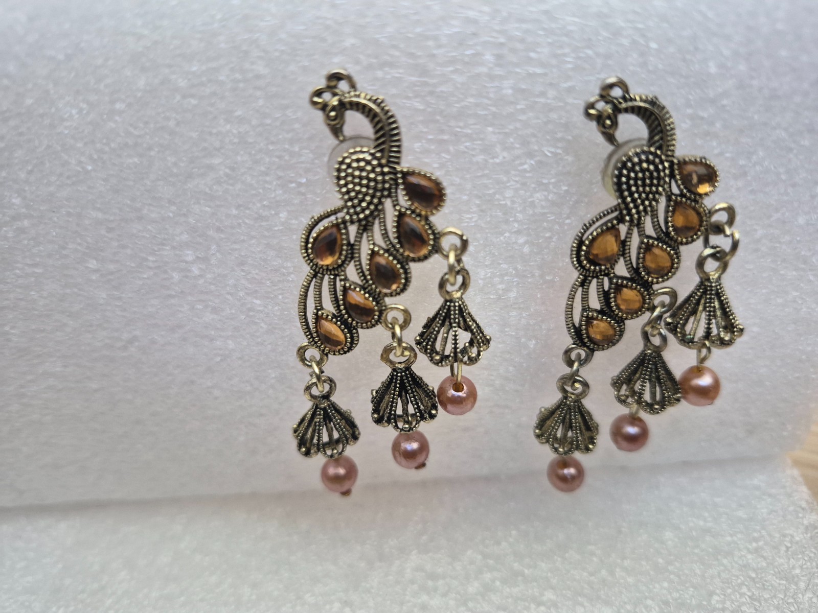 Peacock design Jhumka earrings for women with pearls and stone