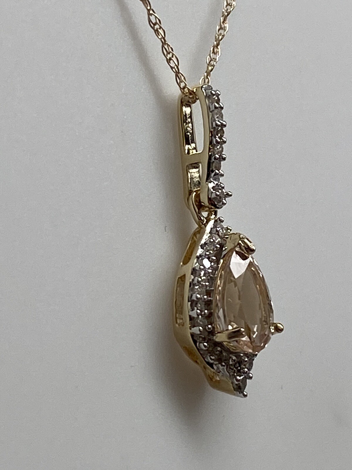 10K Yellow Gold Pear Shape Morganite and 0.11ct twt. Diamond Pendant with Chain