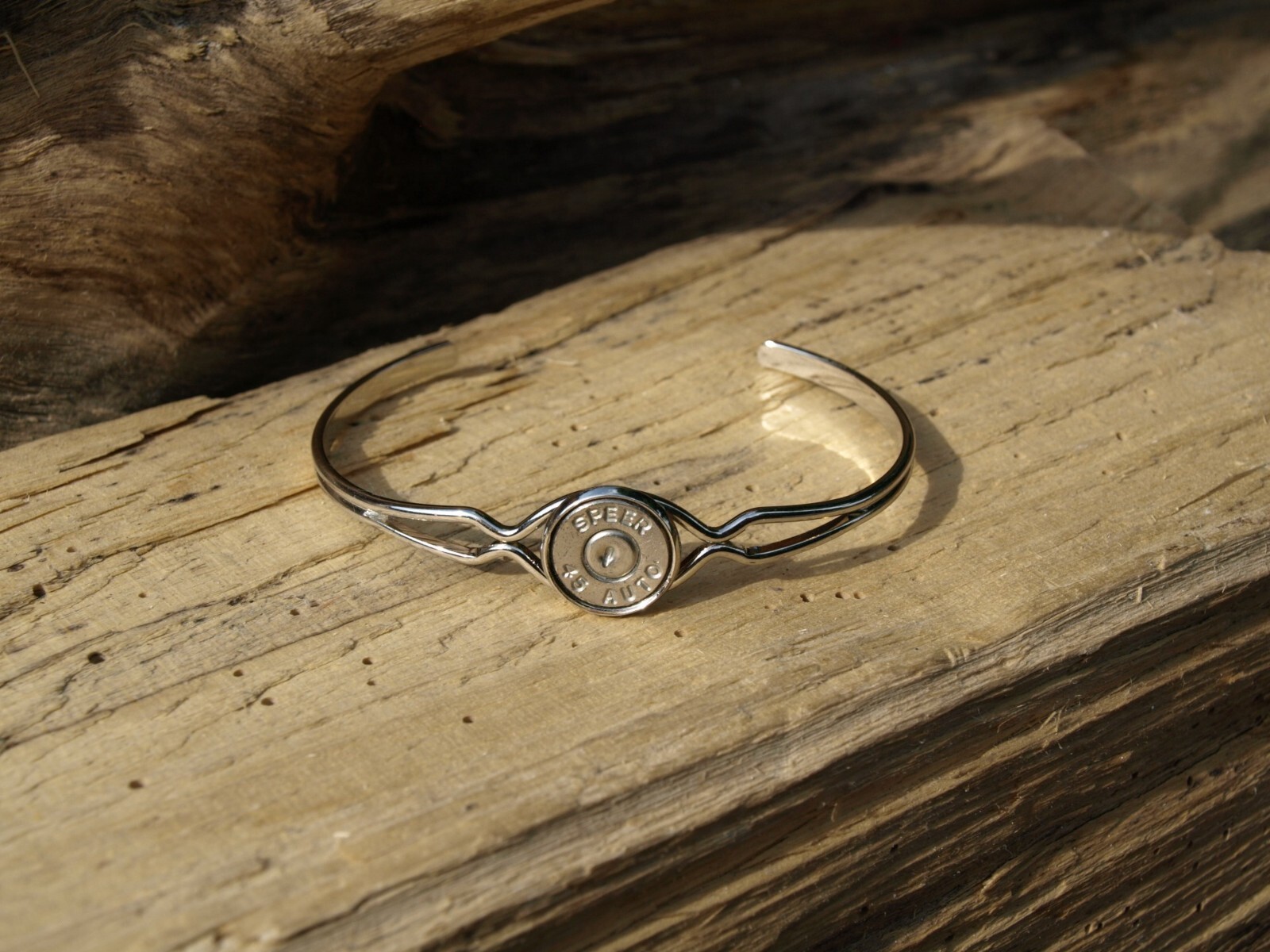 Thin Silver Cuff Bracelet with 45 Auto Bullet Casing. Optional Crystal