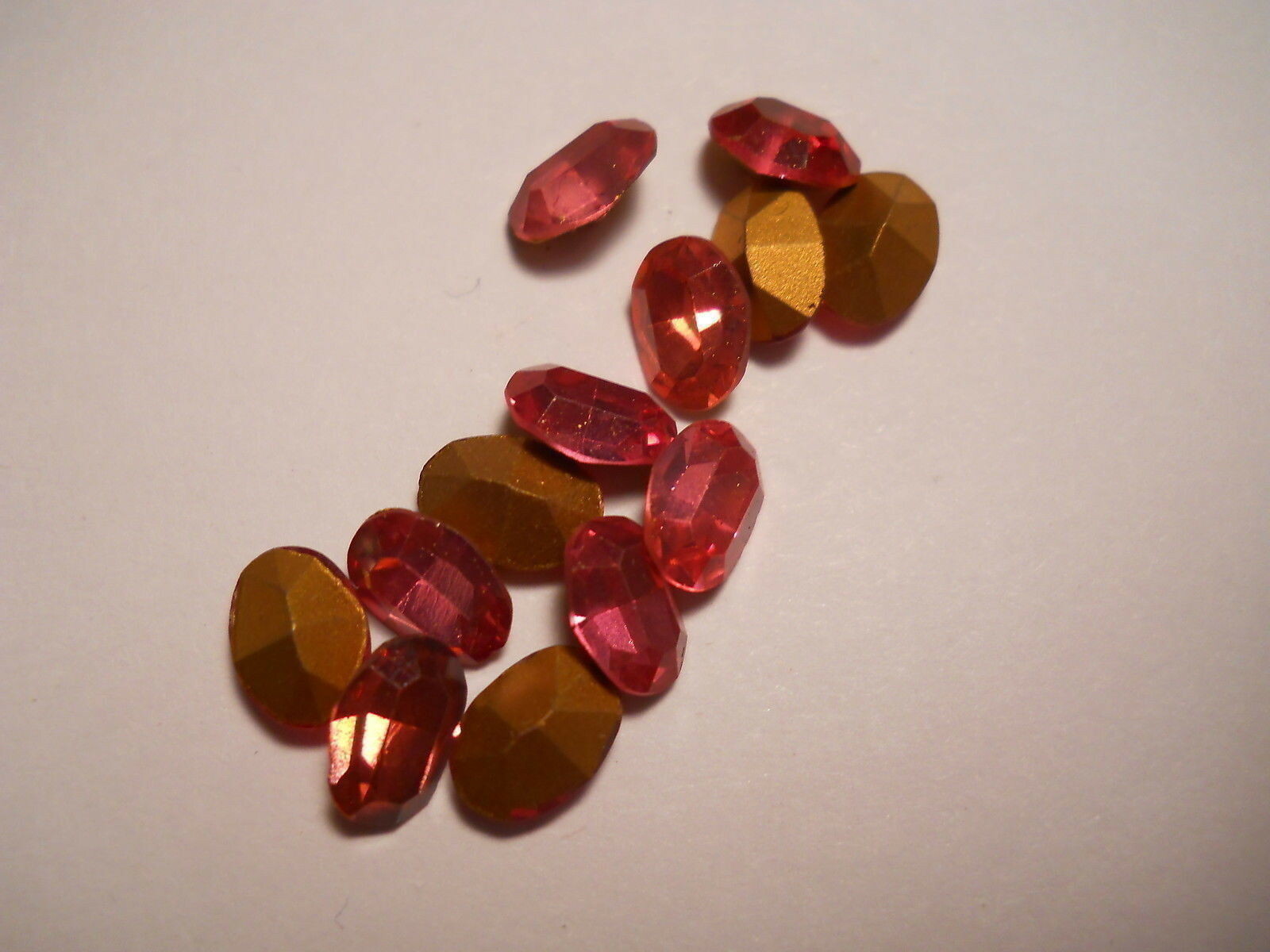 JP69 7x5mm rose machine cut faceted oval glass jewels, gold foiled (72)