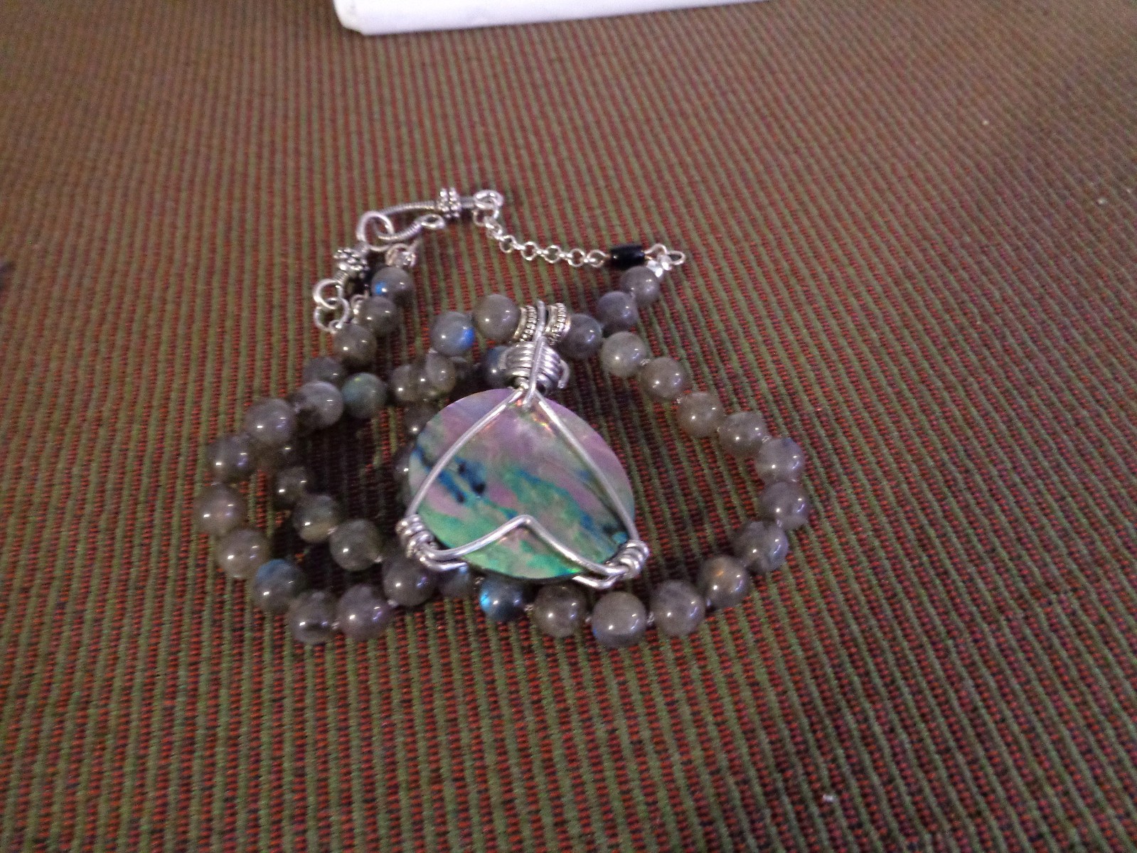 Artisan crafted, gorgeous, aluminum wrapped Paua pendant, on 19” Labradorite str
