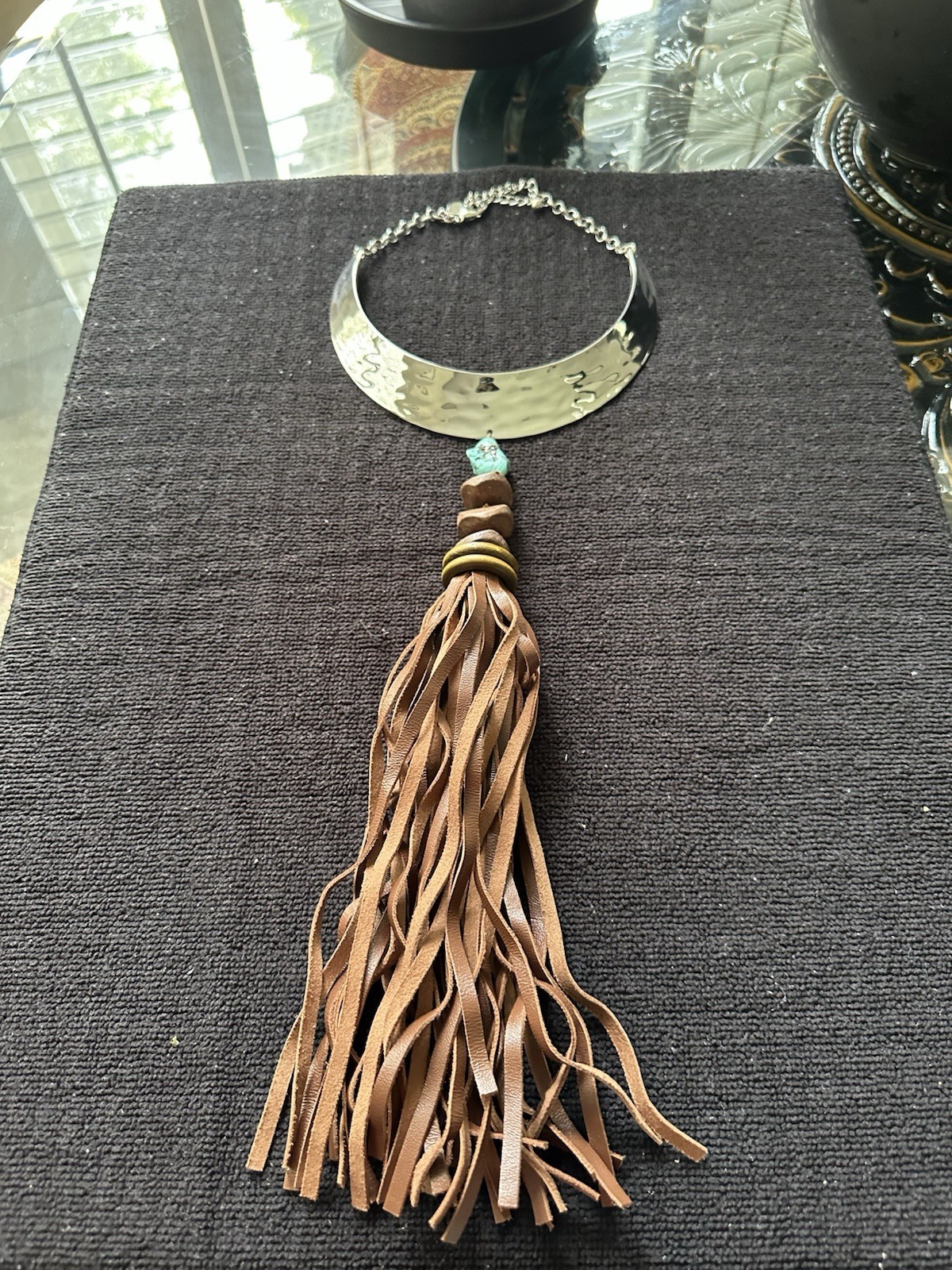 Chico’s boutique necklace; turquoise stone, metal with leather fringes;