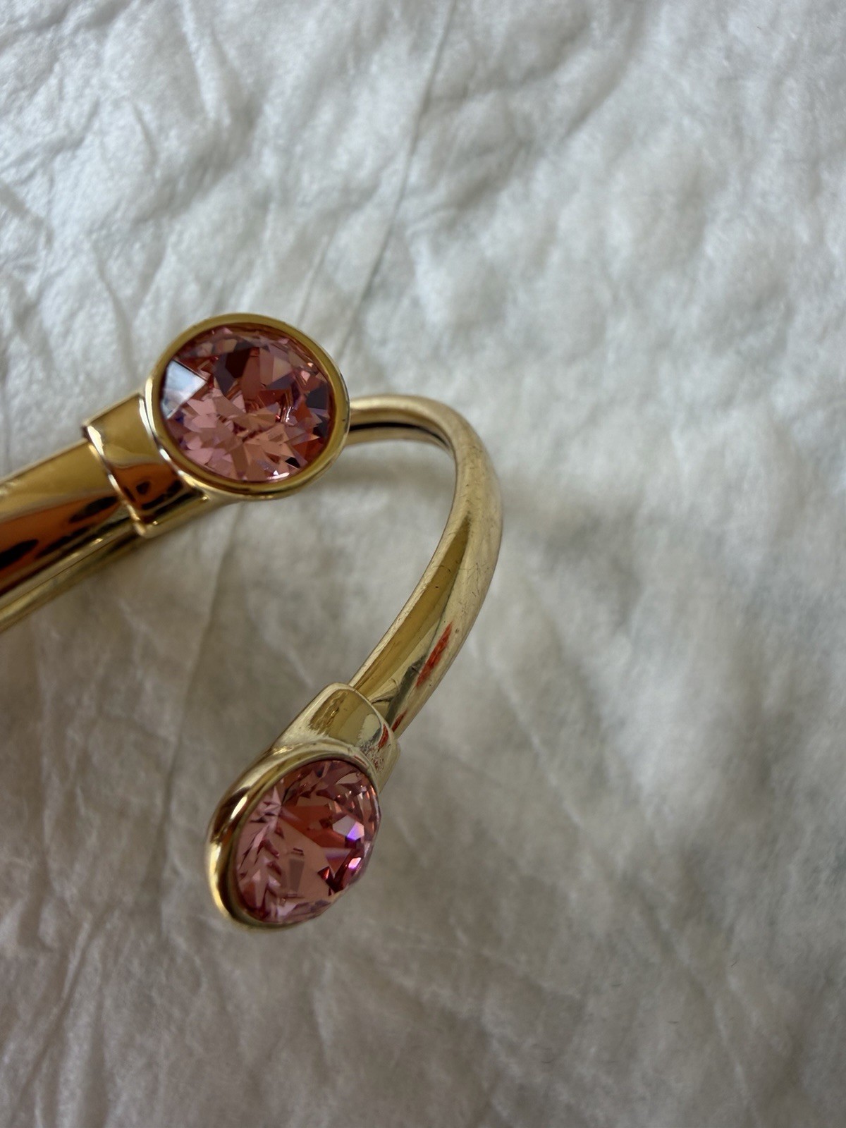 Goldtone Open-Ended Bangle Bracelet with Pink Gemstone Accents