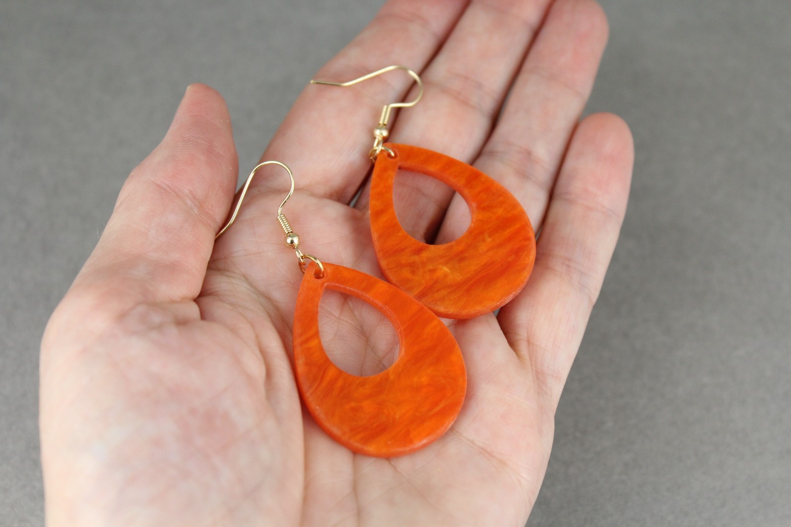 Orange teardrop earrings lightweight dangle cut out oval outline 2.25″ long