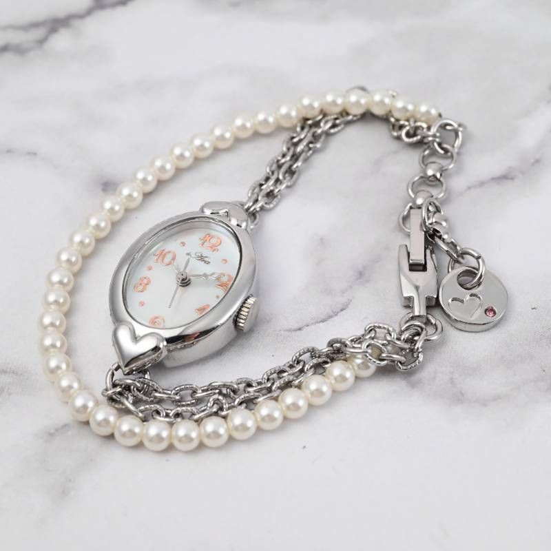 sara ladies’ wristwatch pearl bracelet watch oval shell dial heart motif silver