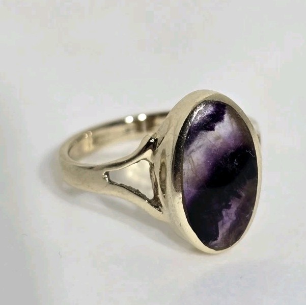 9ct Yellow gold open work ring. Collet set with an oval Blue John Cabochon.