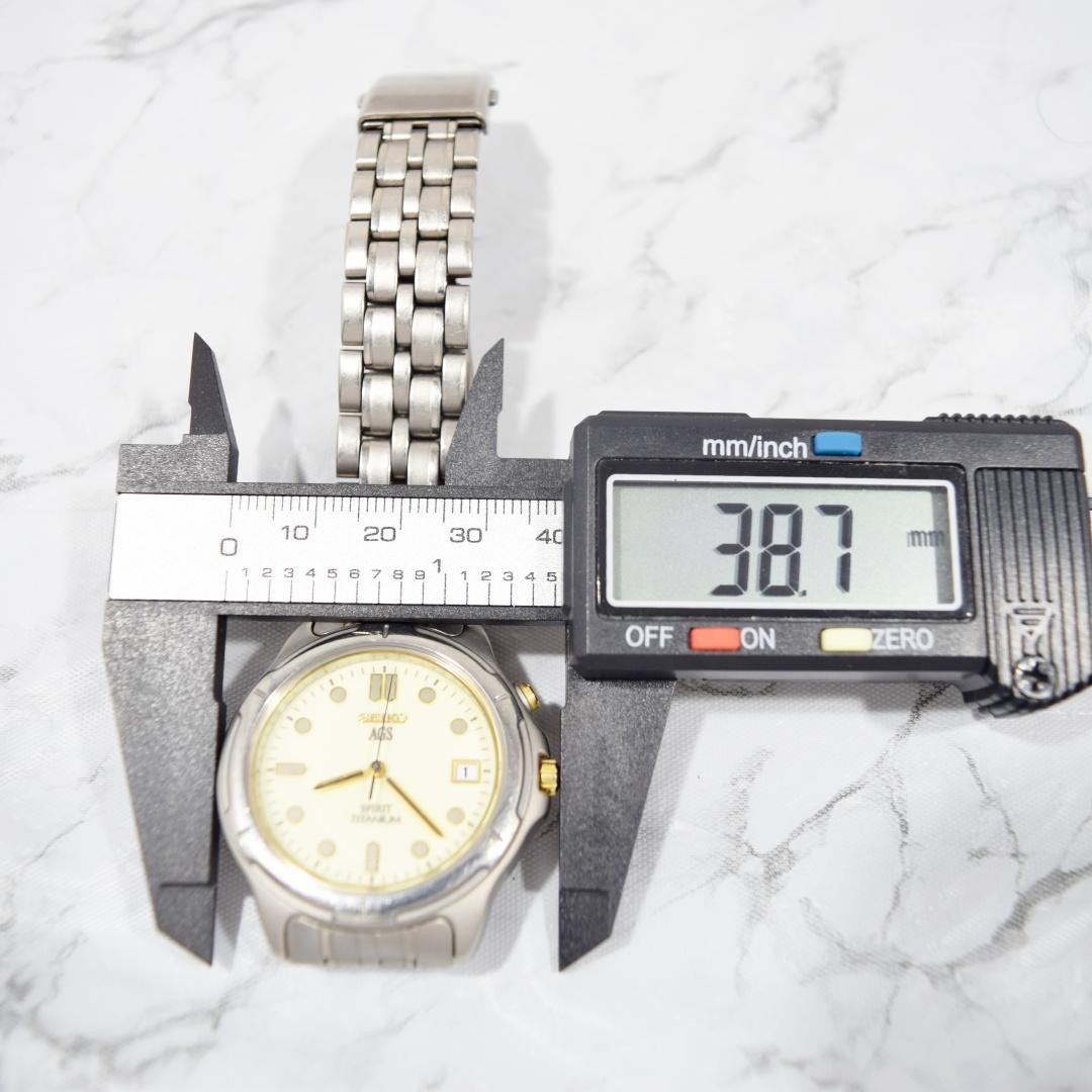 1996 SEIKO Spirit AGS Titanium watch with date display, non-functional.