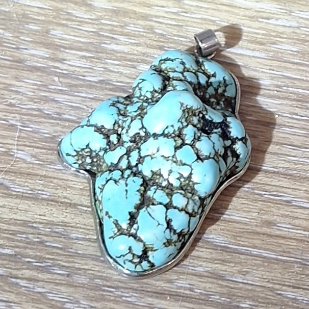 Blue turquoise Stone Pendant Charm with silver outline.