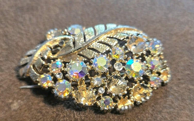 Vintage gold-tone statement brooch from the mid-20th century, costume jewelry