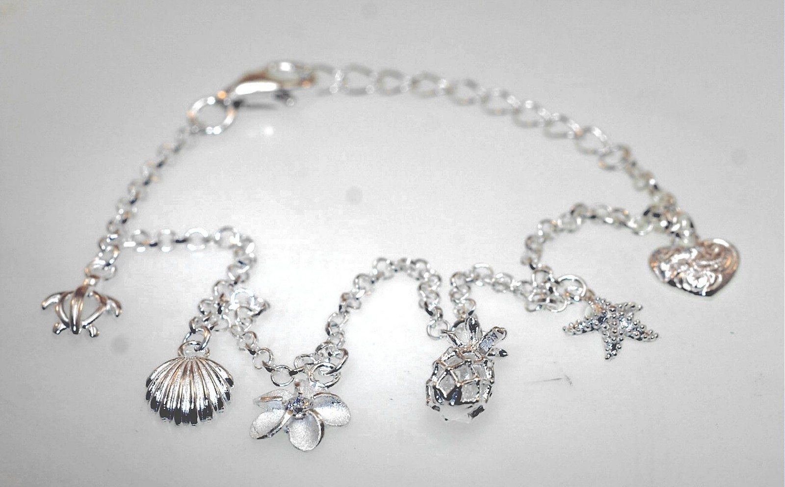 SOLID 925 SILVER MIXED 6 PETITE HAWAIIAN CHARMS DC ROLO BRACELET 6.5″-7.5″ ADJ