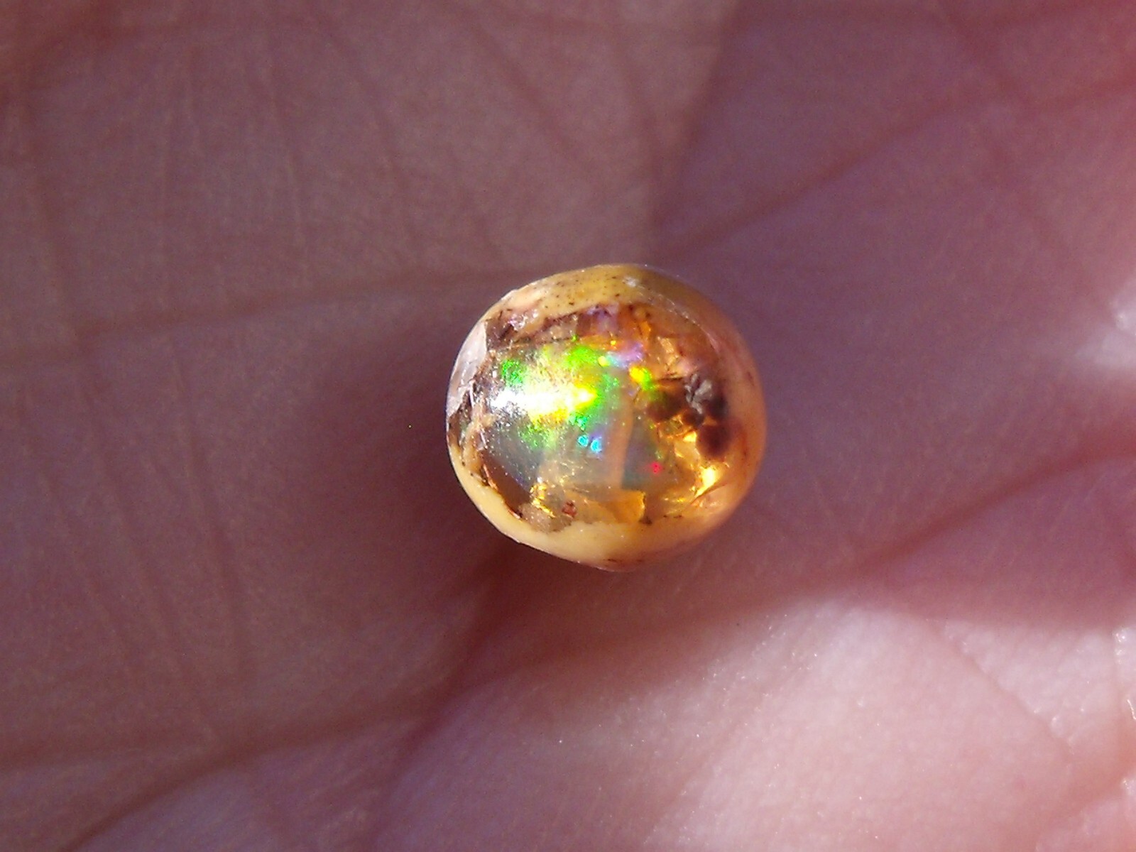 0.82 Ct. Round Cut Mexican Cantera fire opal bead.